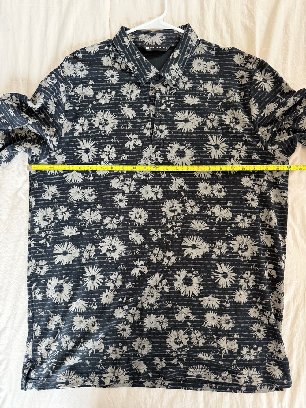 TravisMathew Black Polo with White Floral Print